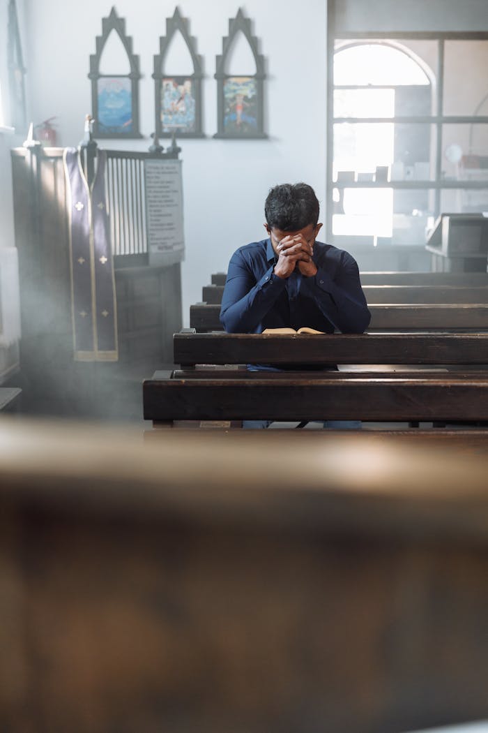 Prayer Sitting on Bench in Church