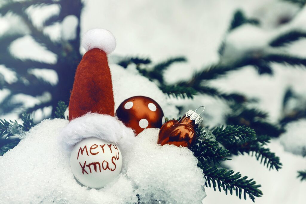 Close-Up Shot of Red and White Christmas Bauble