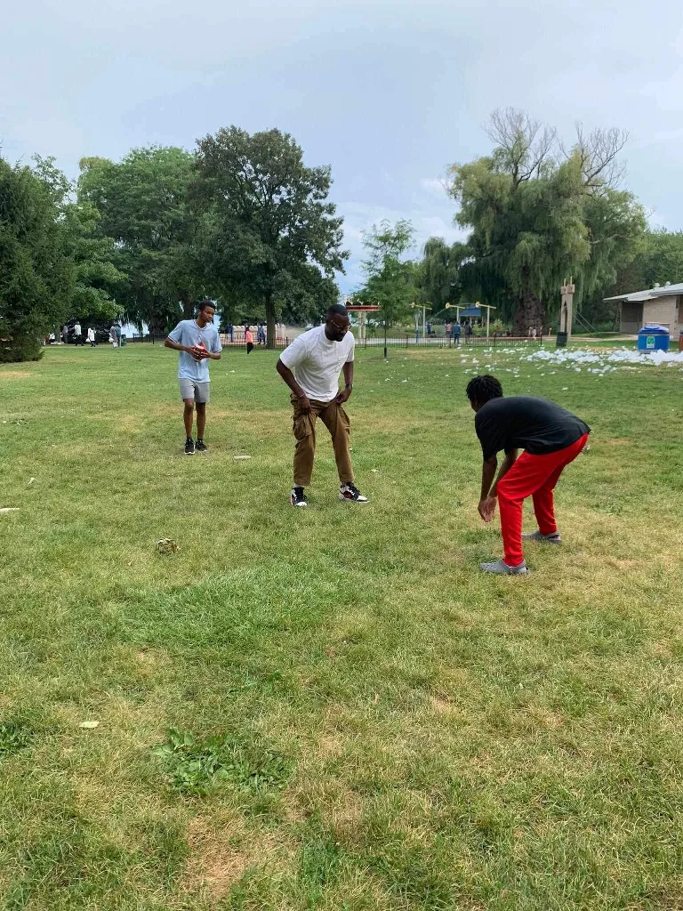 Games in the park: Football at the church picnic.