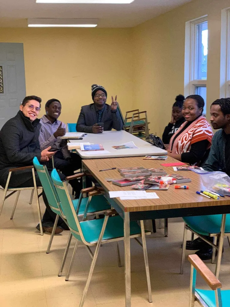 Young adults: Studying the Word around one table.
