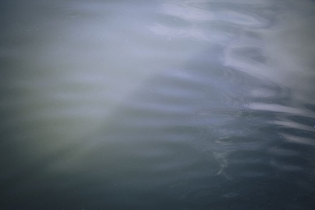 Still, clear water in soft light